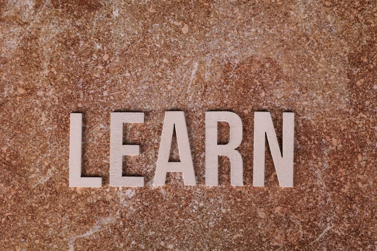 Crafting Captivating Headlines: Your awesome post title goes here Wooden letters spelling 'Learn' on a textured marble surface, symbolizing education and growth.